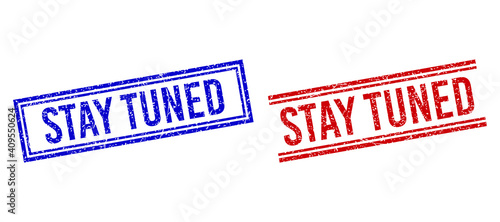 STAY TUNED stamp seal overlays with grunge texture. Vectors designed with double lines, in blue and red variants. Text placed inside double rectangle frame and parallel lines.