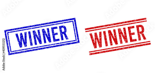 WINNER rubber overlays with distress style. Vectors designed with double lines, in blue and red versions. Text placed inside double rectangle frame and parallel lines.