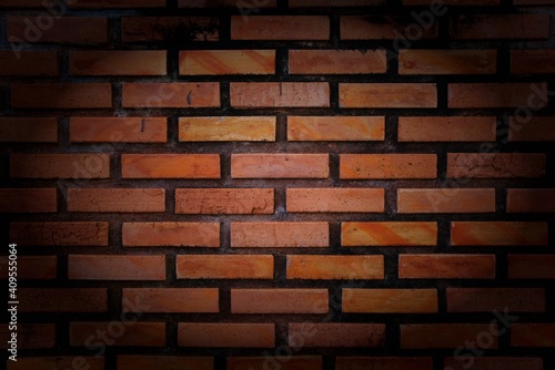 Brick wall with red brick. wall for insert  object. Red texture background vignette.