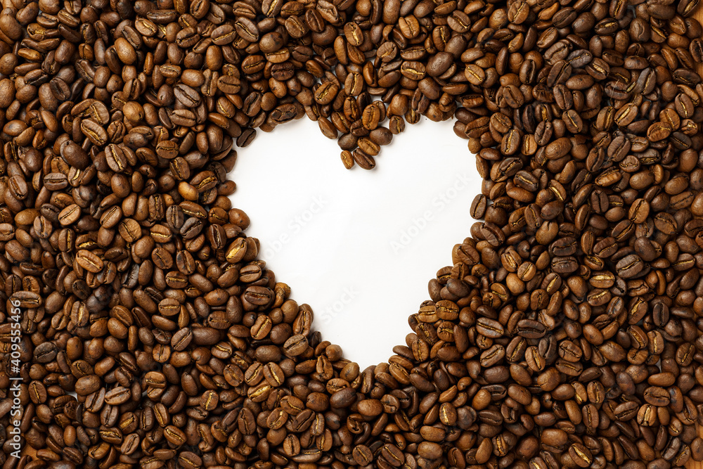 top view of fresh roasted coffee beans with hard in the center, background top view of fresh roasted coffee beans with hard in the center, background