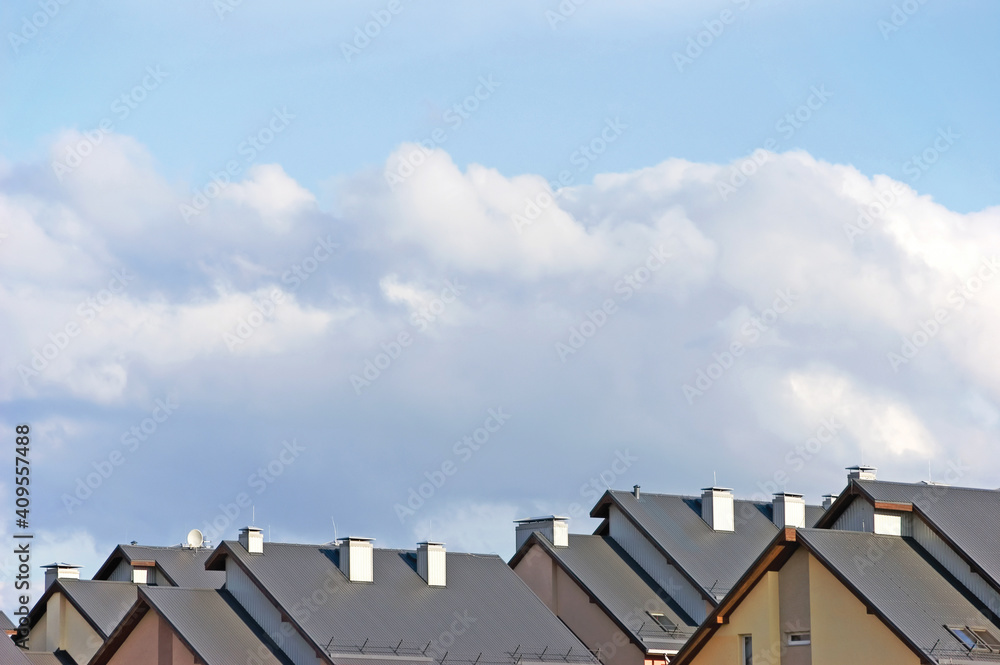 Row house roofs, large detailed panoramic roofscape, condo rowhouse rooftop detail panorama, multiple condos, bright blue summer cloudscape, sunny sky, light clouds
