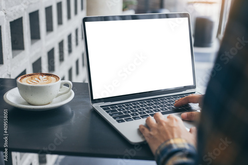 computer screen blank mockup.hand woman work using laptop with white background for advertising,contact business search information on desk at coffee shop.marketing and creative design