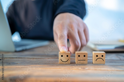 Businessman showing rating with happy icon