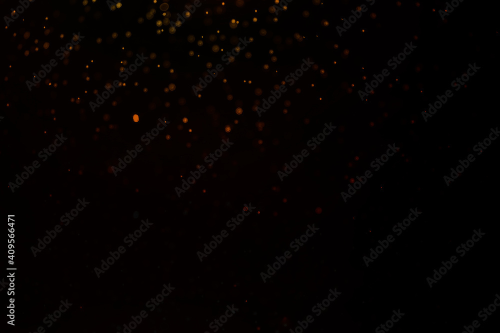 gold glitter explosion on bokeh black background