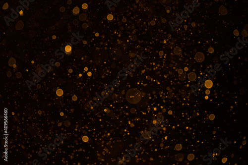 Gold abstract bokeh background. Explosion on black background