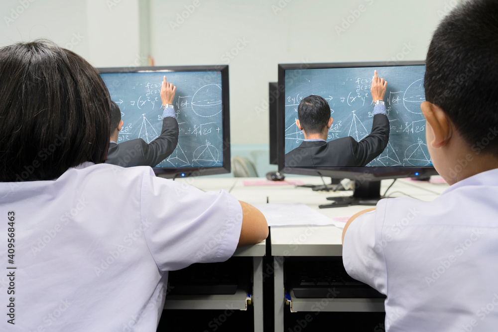 Obraz premium Young student watching lesson online and studying from home.