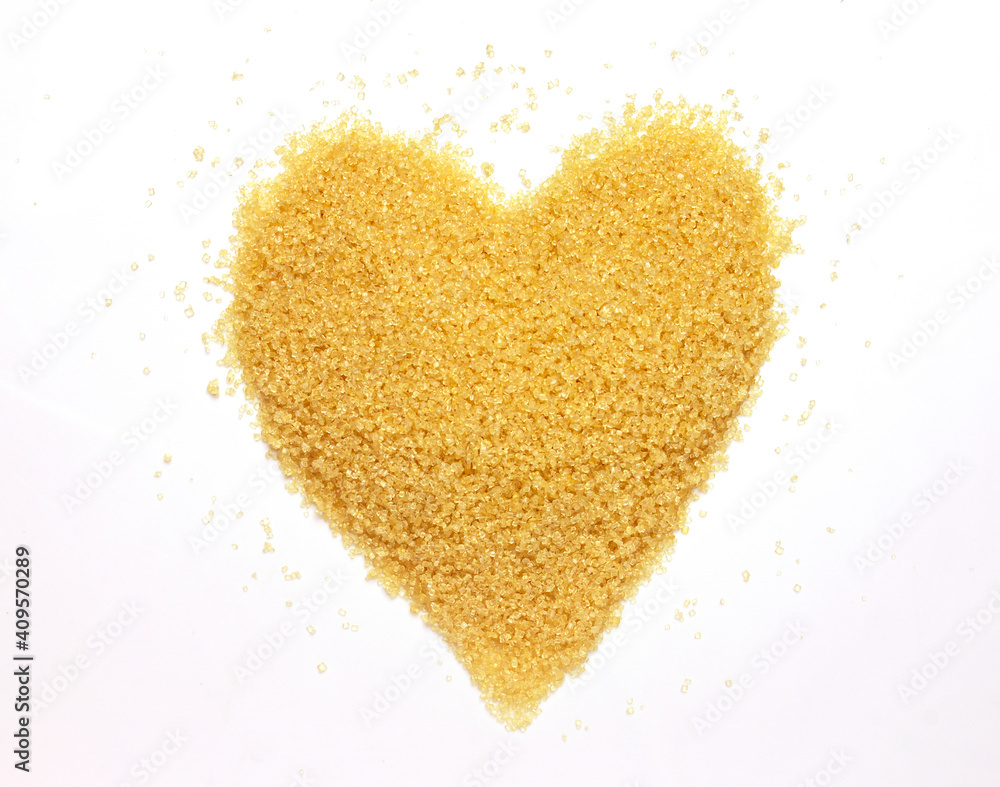 brown sugar in heart shape isolated on white background brown sugar in heart shape isolated on white background