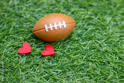 American football with red heart for Valentine's Day concept