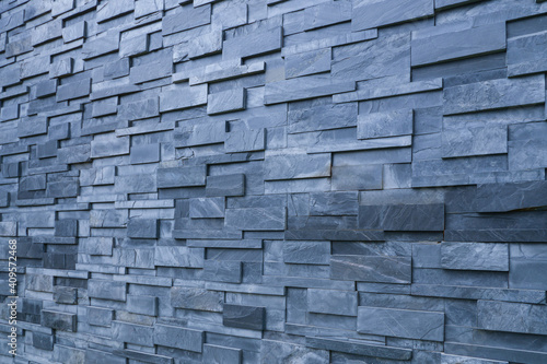 Pieces of stone wall for background or texture, gray pattern of modern design style, real stone wall with layered black