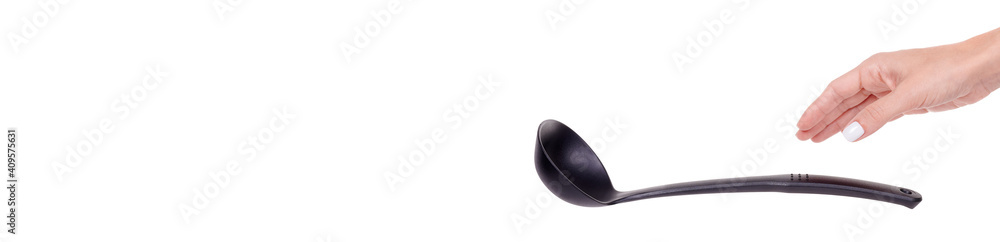 Hand with black plastic ladle, kitchen utensil, isolated on white background. Hand with black plastic ladle, kitchen utensil, isolated on white background.