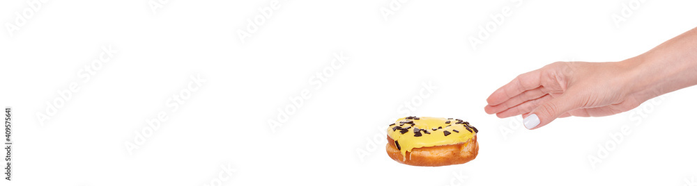 Hand with sweet donut with icing and chocolate drops, isolated on white background. Hand with sweet donut with icing and chocolate drops, isolated on white background.