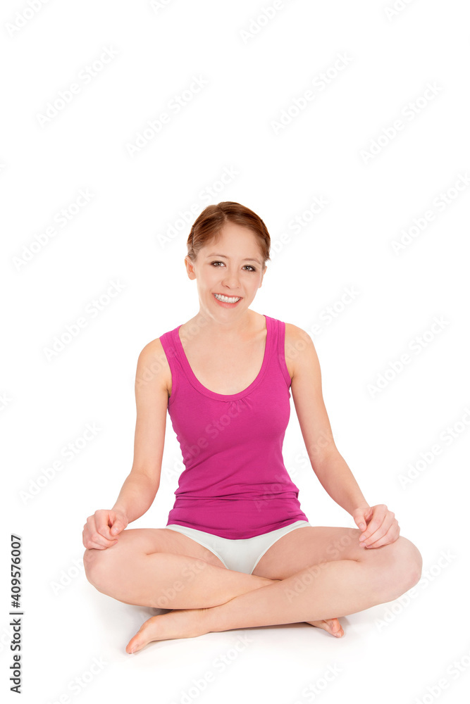 Portrait of an attractive model wearing a pink tank top and white bikini panties in front of white studio background Portrait of an attractive model wearing a pink tank top and white bikini panties in front of white studio background