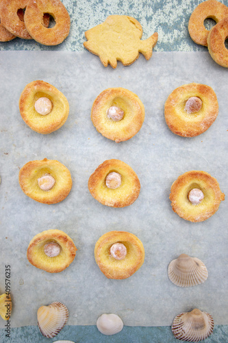 homemade salt and turmeric cookies in the form of seashells, fish and bagels © juliakirillova