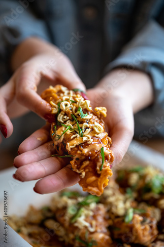 Korean fried chicken tender with hands holding © arekor