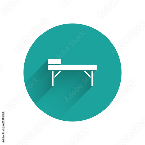 White Massage table icon isolated with long shadow. Green circle button. Vector.