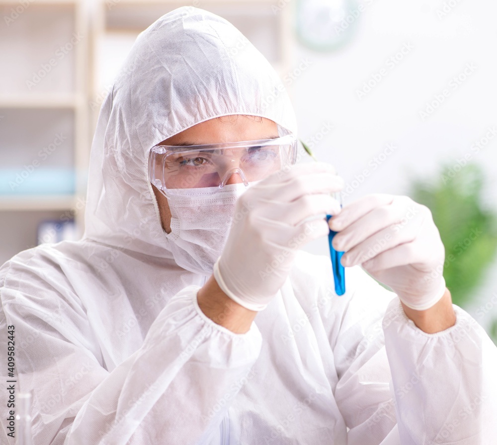 Young chemist student working in lab on chemicals Young chemist student working in lab on chemicals