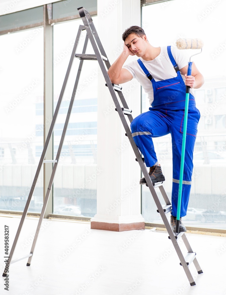 Painter repairman working at construction site Painter repairman working at construction site