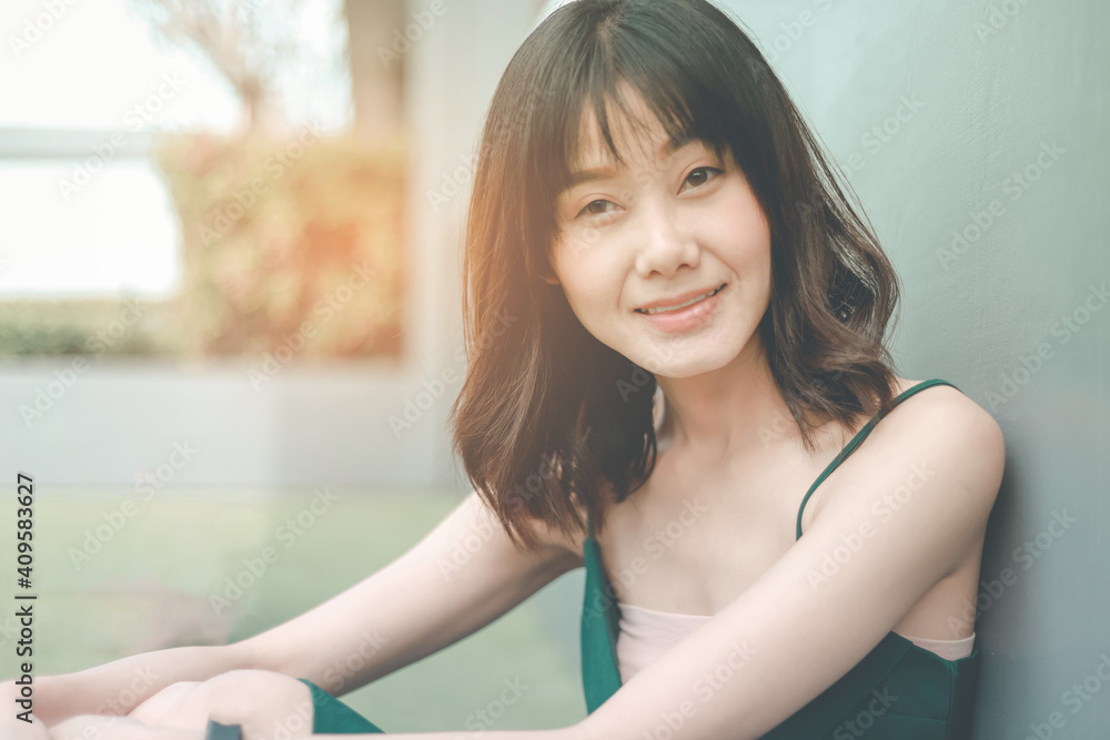 A beautiful Asian short hair girl smailing.