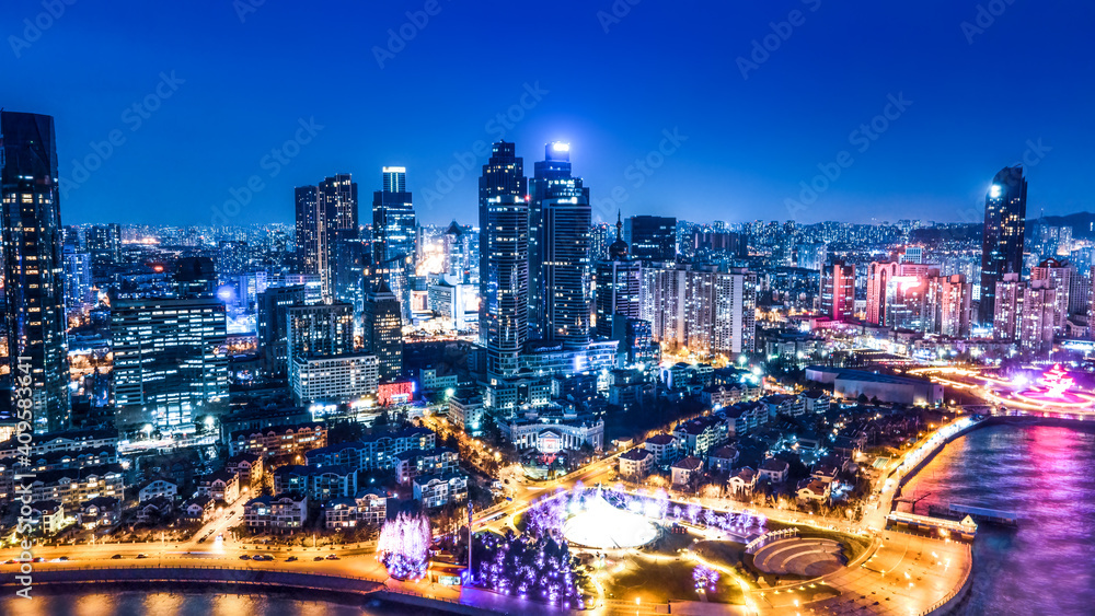 Night view of modern city buildings in Qingdao, China