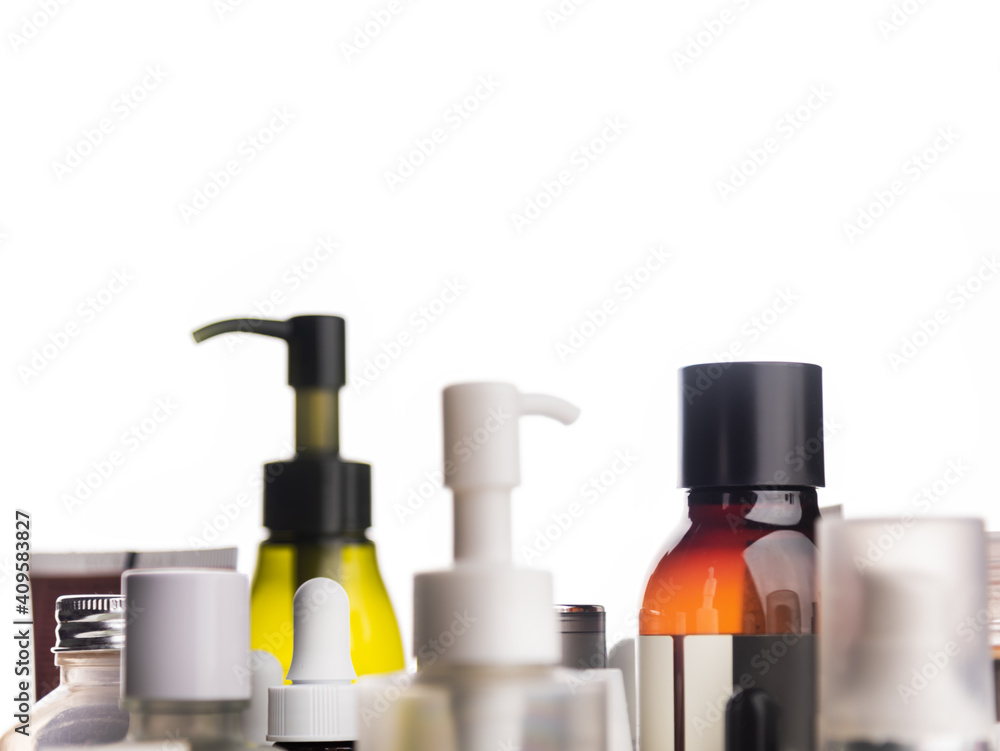 Many cosmetics tubes on white background in shallow depth of field. Many cosmetics tubes on white background in shallow depth of field.