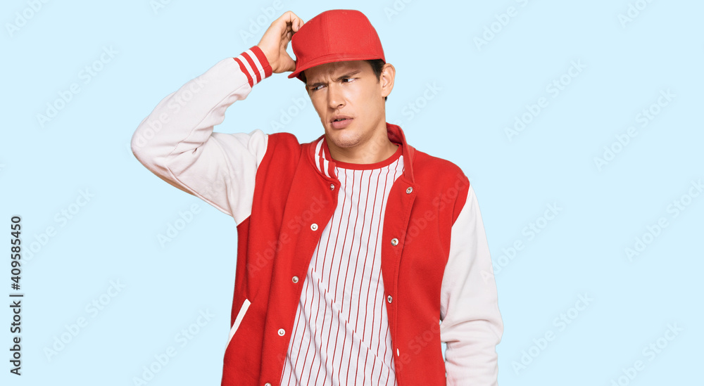 Handsome caucasian man wearing baseball uniform confuse and wonder about question. uncertain with doubt, thinking with hand on head. pensive concept. Handsome caucasian man wearing baseball uniform confuse and wonder about question. uncertain with doubt, thinking with hand on head. pensive concept.
