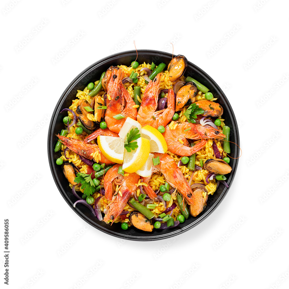 Traditional spanish seafood paella in the fry pan isolated on white background Traditional spanish seafood paella in the fry pan isolated on white background