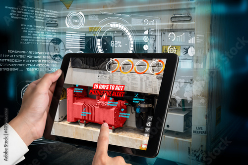 Engineer use augmented reality software in smart factory production line with automated application . Futuristic machinery in working in concept of Industry 4.0 or 4th industrial revolution. photo