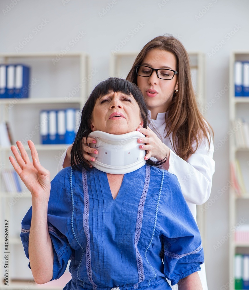 Senior woman with neck injury at doctors