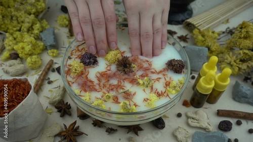Spa for hands, natural bath for skin. Alternative medicine, organic cosmetics, aromatherapy and natural care concept.