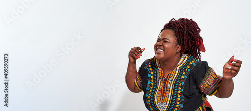 Photography Cheerful plump young haitian woman laughing out loud