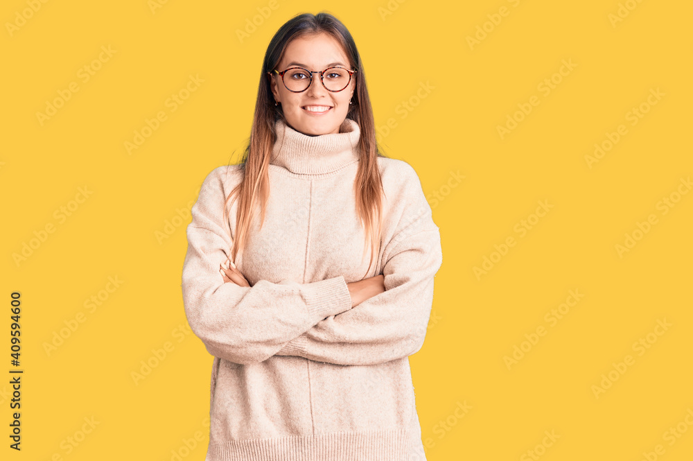 Beautiful caucasian woman wearing wool winter sweater happy face smiling with crossed arms looking at the camera. positive person. Beautiful caucasian woman wearing wool winter sweater happy face smiling with crossed arms looking at the camera. positive person.