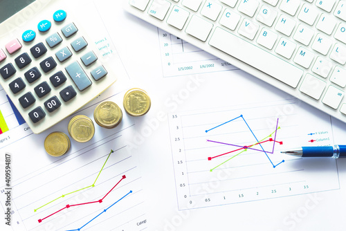 financial accounting analytics document report paperwork progress growth graph with money and chart on table with pen keyboard and calculator work for business planning.