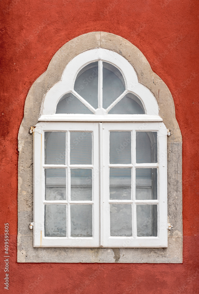 The window on the red wall of the Pena National Palace in Sintra town, Portugal