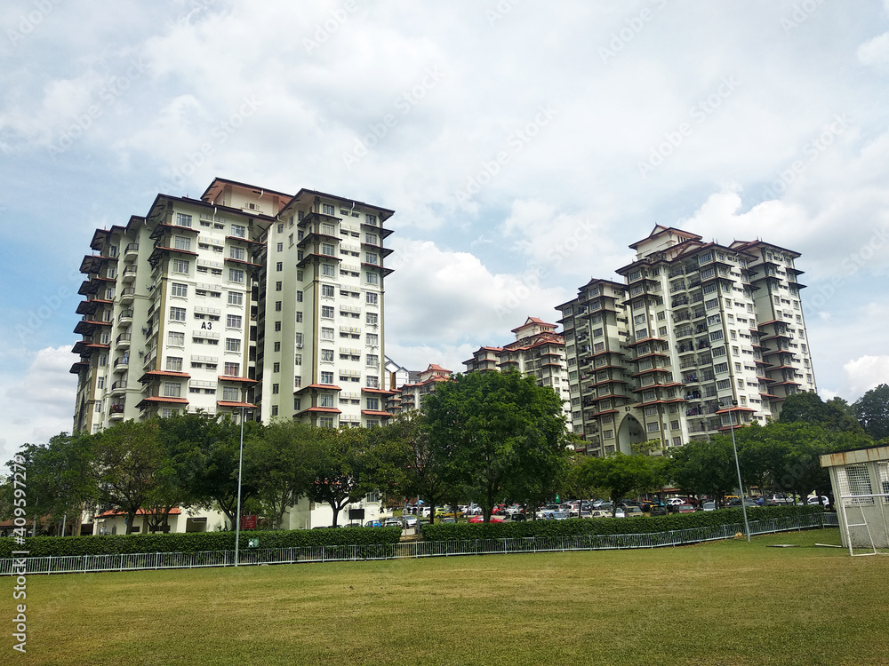 SELANGOR, MALAYSIA -JULY 22, 2020: High rise apartment building with modern facade design. Popular in the urban areas in Malaysia. Various facilities for the use of the residents are provided. SELANGOR, MALAYSIA -JULY 22, 2020: High rise apartment building with modern facade design. Popular in the urban areas in Malaysia. Various facilities for the use of the residents are provided.