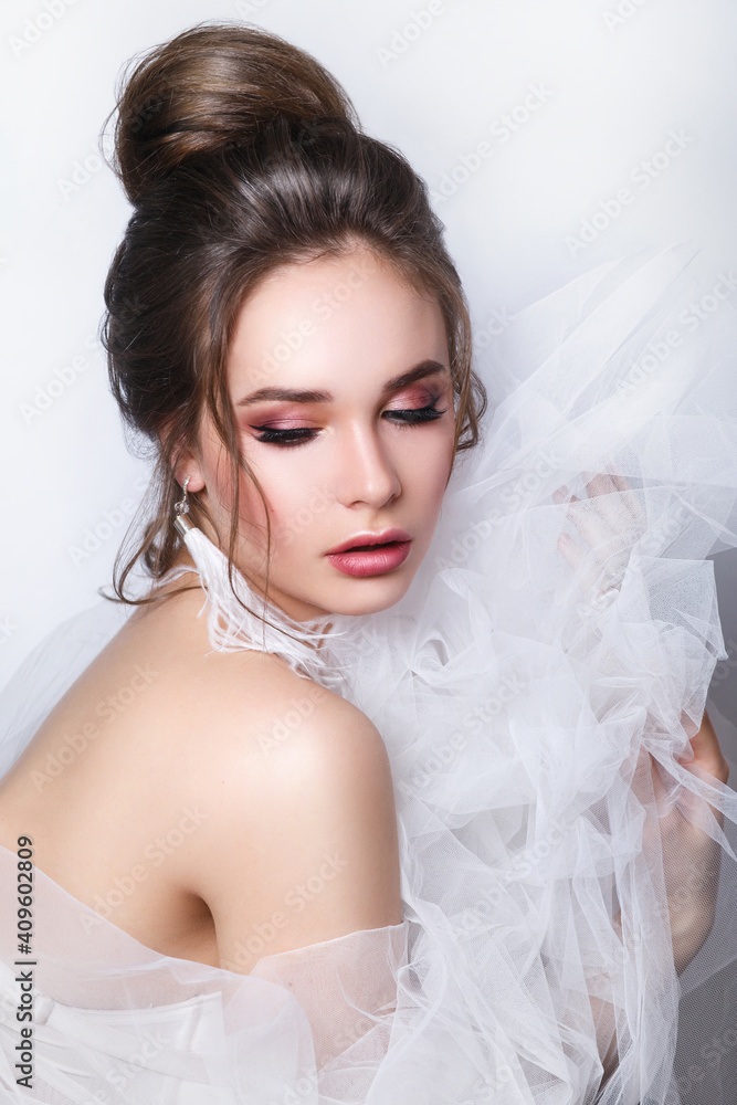 Beautiful bride with fashion wedding hairstyle on white background Beautiful bride with fashion wedding hairstyle on white background