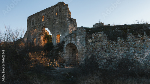 Ancient stone castle ruins. Sunset