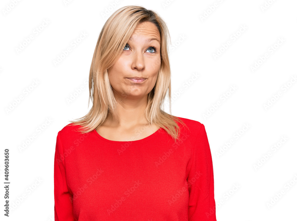 Middle age caucasian woman wearing casual clothes smiling looking to the side and staring away thinking. Middle age caucasian woman wearing casual clothes smiling looking to the side and staring away thinking.