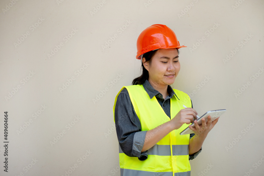 Engineer woman wearing uniform and safety helmet inspection work Engineer woman wearing uniform and safety helmet inspection work