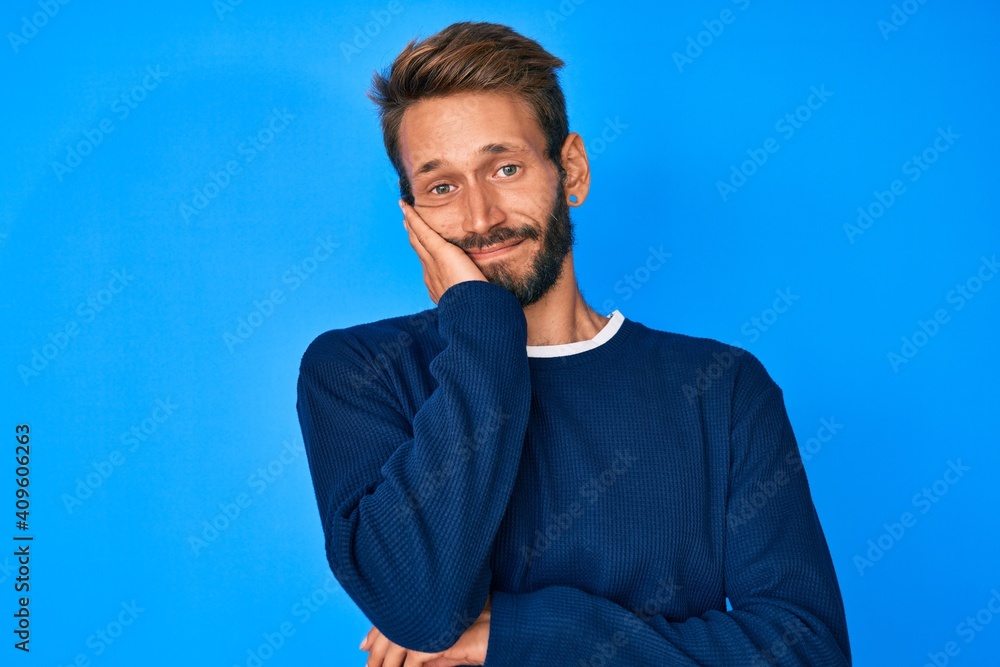 Handsome caucasian man with beard wearing casual sweater thinking looking tired and bored with depression problems with crossed arms. Handsome caucasian man with beard wearing casual sweater thinking looking tired and bored with depression problems with crossed arms.
