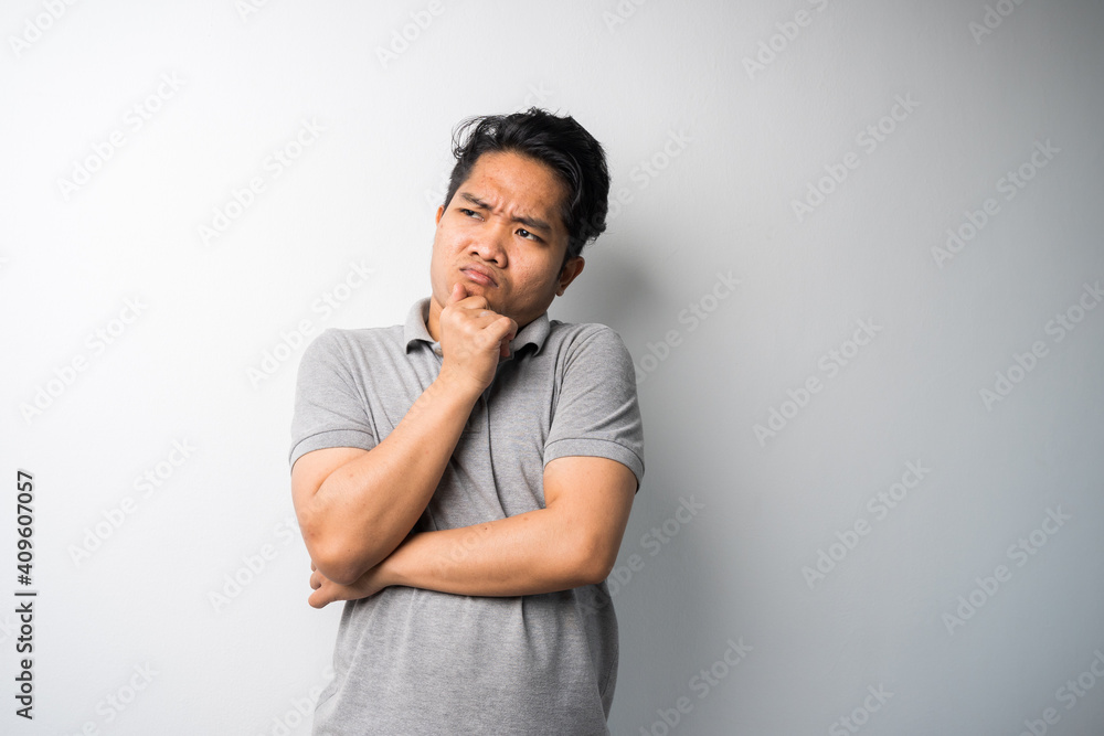 Portrait of Young Asian man, pointing with exciting, happy face expression, new fresh idea for advertisement. isolated selective focus. Portrait of Young Asian man, pointing with exciting, happy face expression, new fresh idea for advertisement. isolated selective focus.
