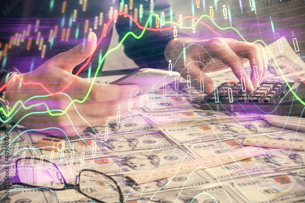 Double exposure of man's hands holding and using a digital device and forex graph drawing. Financial market concept. Double exposure of man's hands holding and using a digital device and forex graph drawing. Financial market concept.