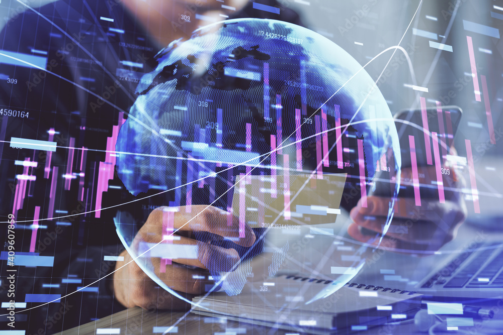 Double exposure of man's hands holding and using a phone and financial graph drawing. Analysis concept. Double exposure of man's hands holding and using a phone and financial graph drawing. Analysis concept.
