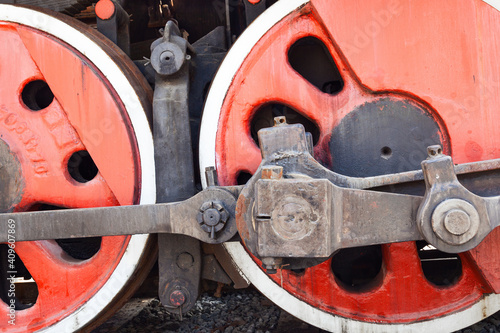 Closeup shot for the steam locomotive, the wheel and the axle and driving shaft.