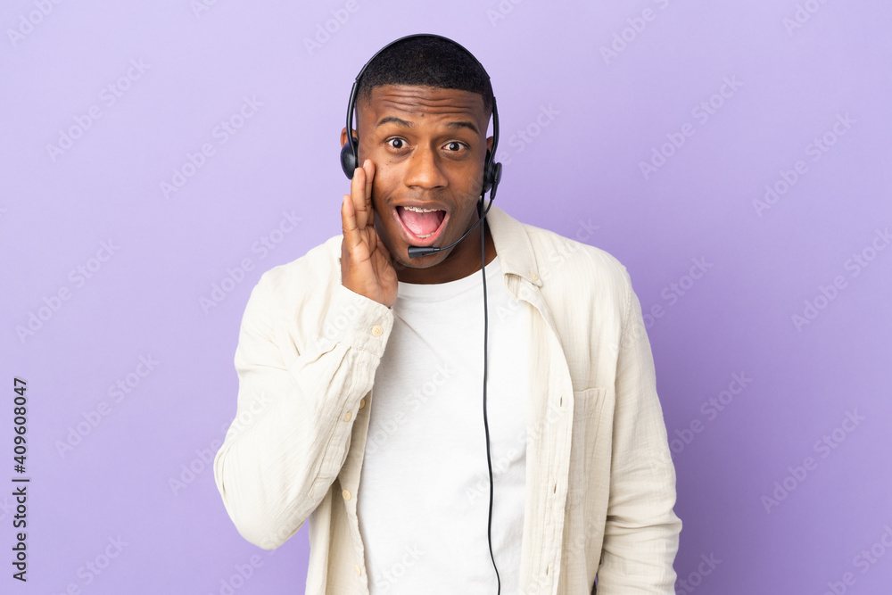 Telemarketer latin man working with a headset isolated on purple background with surprise and shocked facial expression Telemarketer latin man working with a headset isolated on purple background with surprise and shocked facial expression