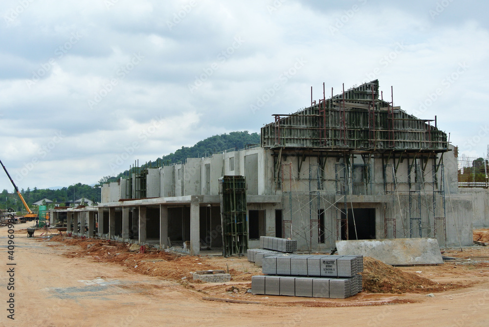 SEREMBAN, MALAYSIA -APRIL 09, 2020: New double story luxury terrace house under construction in Malaysia. Designed by an architect with a modern and contemporary style. SEREMBAN, MALAYSIA -APRIL 09, 2020: New double story luxury terrace house under construction in Malaysia. Designed by an architect with a modern and contemporary style.