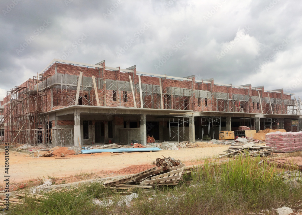 SEREMBAN, MALAYSIA -APRIL 09, 2020: New double story luxury terrace house under construction in Malaysia. Designed by an architect with a modern and contemporary style. SEREMBAN, MALAYSIA -APRIL 09, 2020: New double story luxury terrace house under construction in Malaysia. Designed by an architect with a modern and contemporary style.