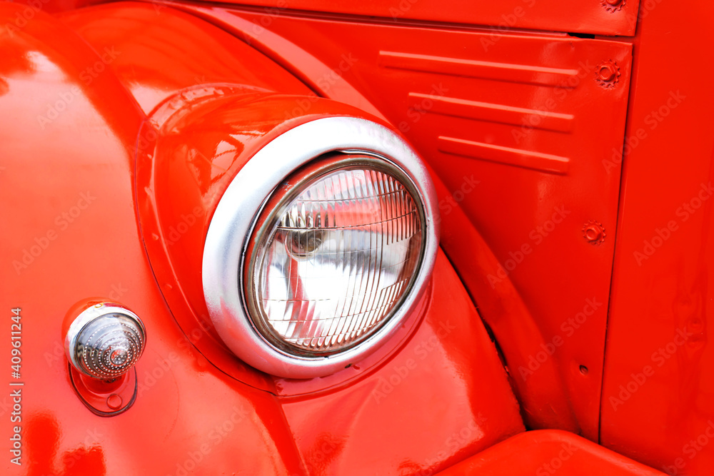 Headlight retro car. Vintage car red. Demonstration of museum exhibits.