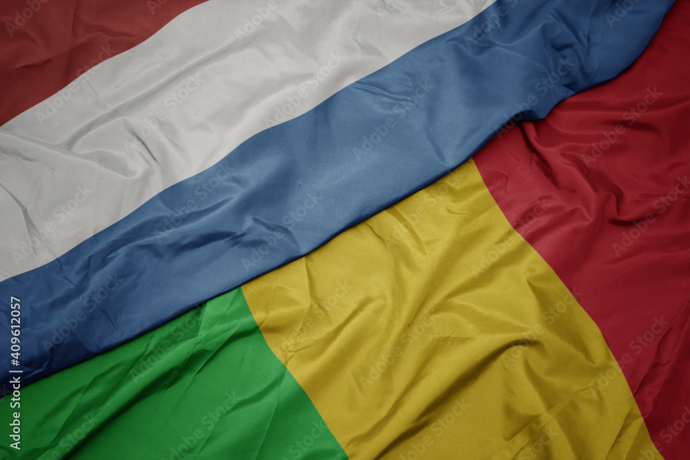 waving colorful flag of mali and national flag of luxembourg.