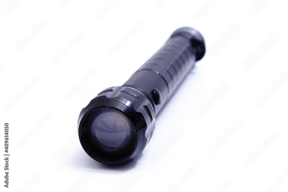 Black big LED flashlight photographer on a white background. Black big LED flashlight photographer on a white background.
