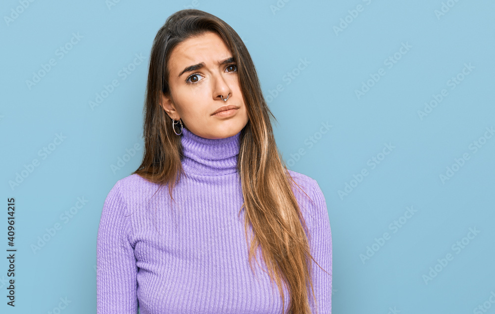 Young hispanic woman wearing casual clothes skeptic and nervous, frowning upset because of problem. negative person. Young hispanic woman wearing casual clothes skeptic and nervous, frowning upset because of problem. negative person.